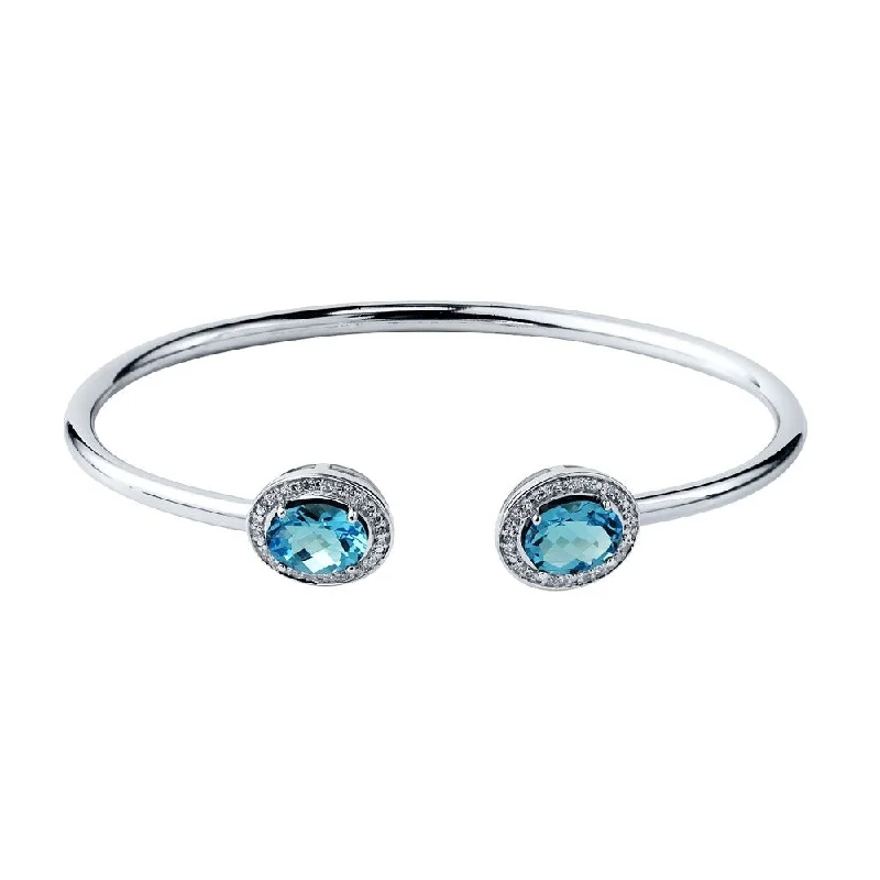 artisan-crafted silver bracelet-Auriya 2 1/2ct Oval Swiss Blue Topaz Gold over Silver Bangle Bracelet with Diamond Accents