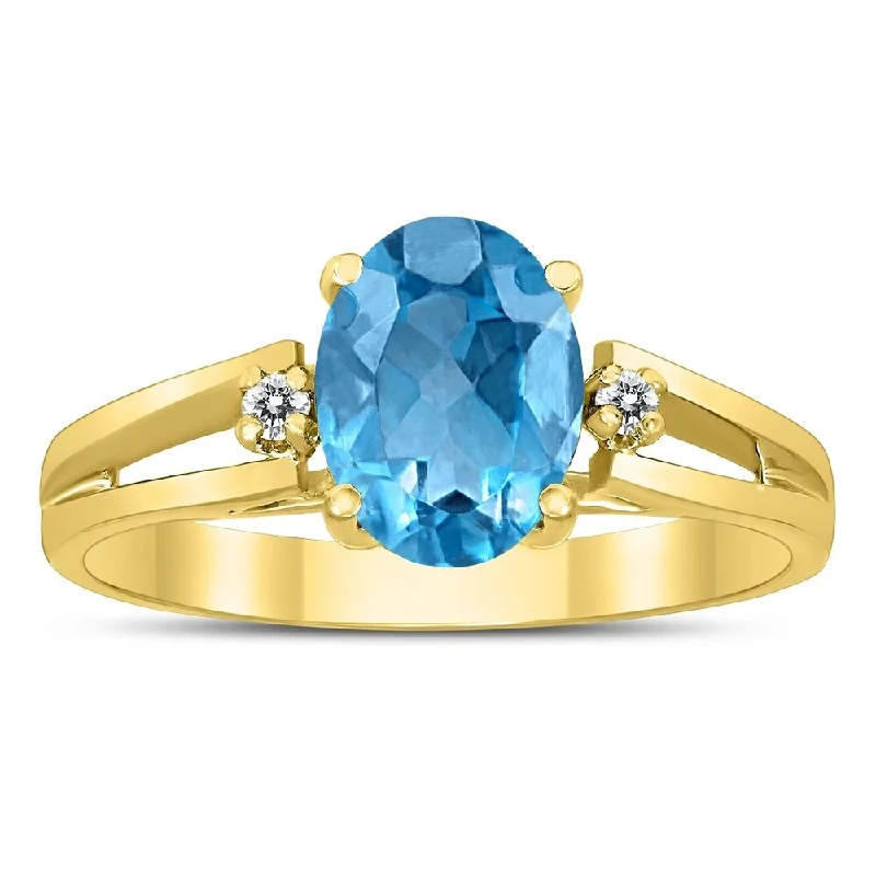 gothic-inspired panther claw ring-8X6MM Blue Topaz and Diamond Open Three Stone Ring in 10K Yellow Gold